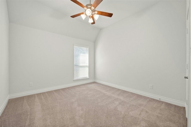 unfurnished room with light carpet, lofted ceiling, and ceiling fan