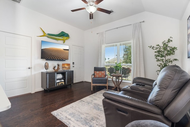 living room featuring vaulted ceiling, ceiling fan, dark wood-style flooring, and visible vents