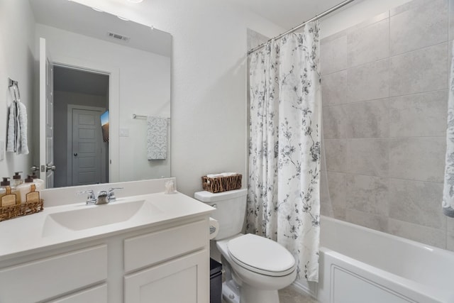 bathroom with toilet, vanity, visible vents, and shower / tub combo with curtain