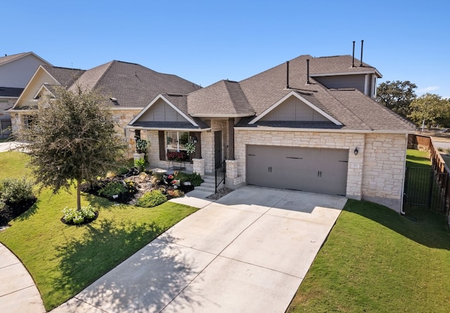 craftsman-style house featuring driveway, a shingled roof, and a front yard