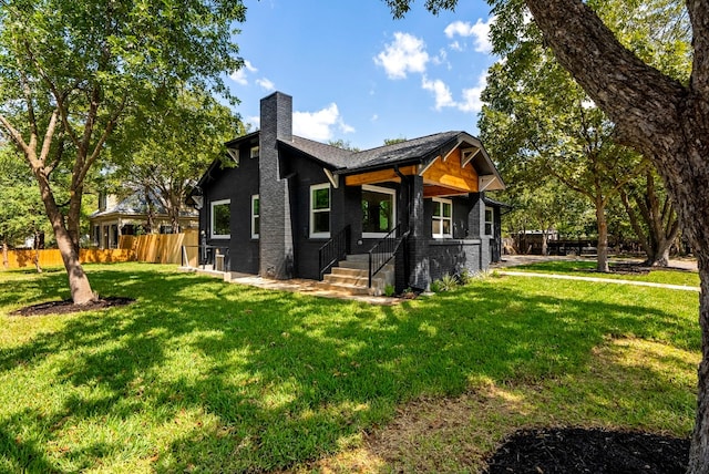 view of side of property featuring a yard