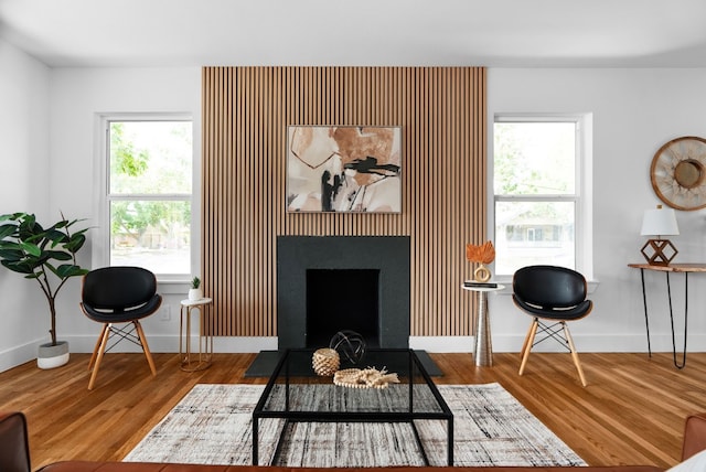 sitting room with hardwood / wood-style floors