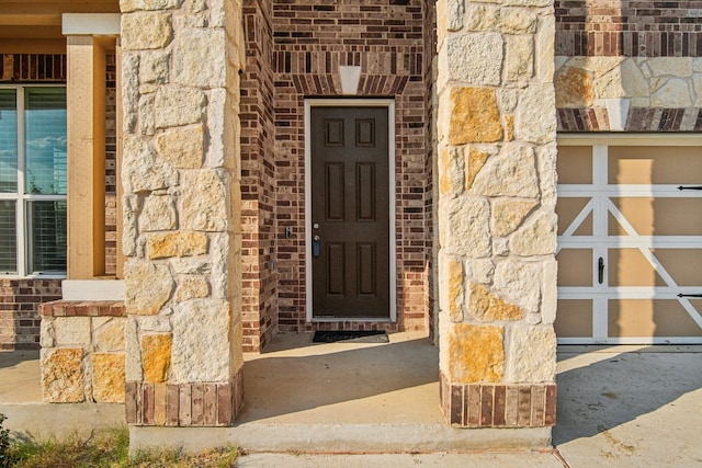 property entrance with a garage