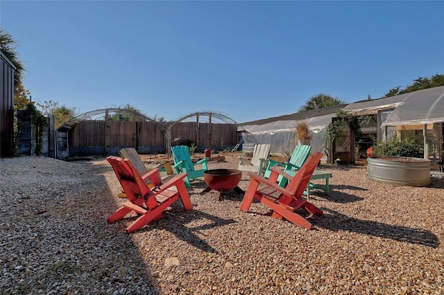 view of jungle gym featuring an outdoor fire pit