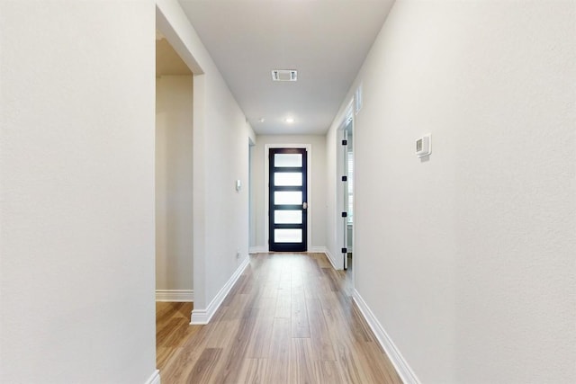 doorway to outside with light hardwood / wood-style floors