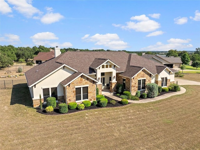 504 Pheasant Mdw, Liberty Hill, TX 78642 - craftsman house with stone siding, roof with shingles, and stucco siding