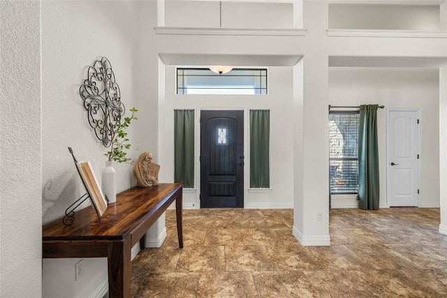504 Pheasant Mdw, Liberty Hill, TX 78642 - entrance foyer with a towering ceiling, plenty of natural light, and baseboards