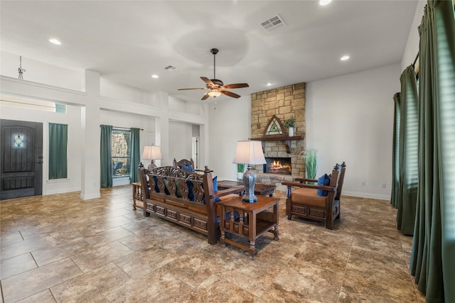 living area with recessed lighting, a fireplace, visible vents, and a ceiling fan