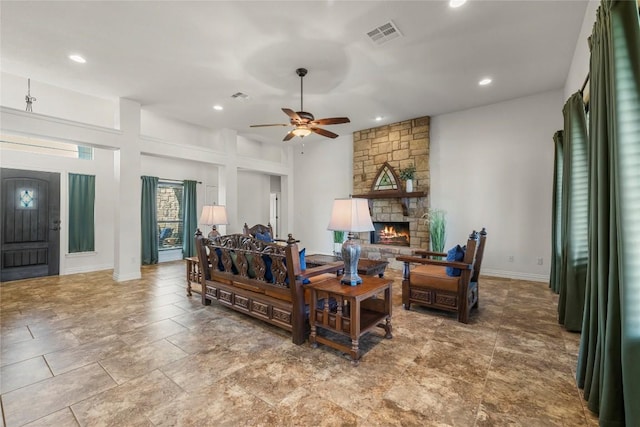504 Pheasant Mdw, Liberty Hill, TX 78642 - living room featuring a ceiling fan, a stone fireplace, recessed lighting, and baseboards