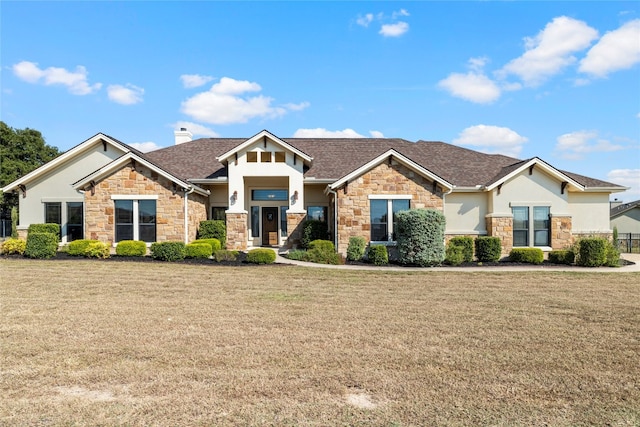 craftsman-style house featuring a front yard