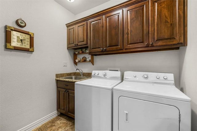 504 Pheasant Mdw, Liberty Hill, TX 78642 - washroom featuring cabinet space, independent washer and dryer, and baseboards