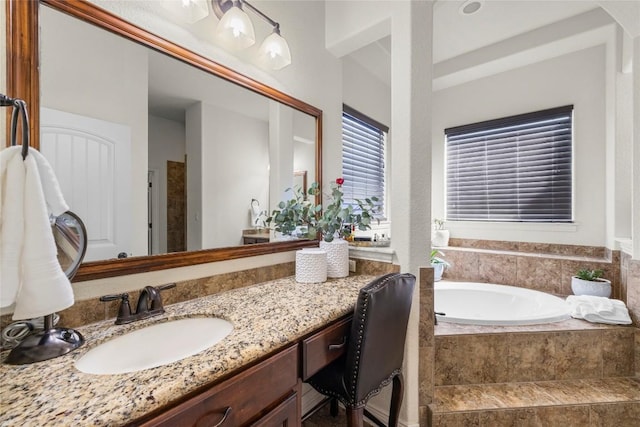 504 Pheasant Mdw, Liberty Hill, TX 78642 - bathroom featuring a garden tub and vanity