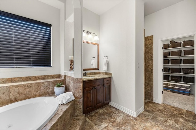 504 Pheasant Mdw, Liberty Hill, TX 78642 - bathroom with a garden tub and vanity