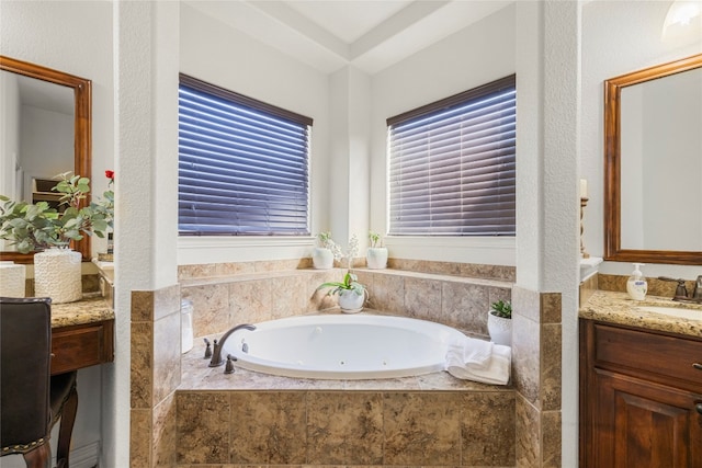 bathroom with vanity and a relaxing tiled tub