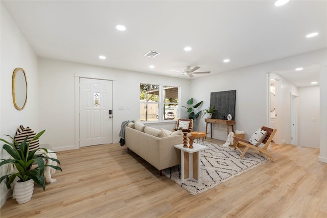 living area featuring recessed lighting, visible vents, and light wood-style flooring