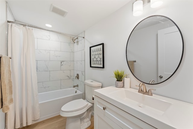 full bathroom with shower / bath combination with curtain, vanity, toilet, and hardwood / wood-style floors