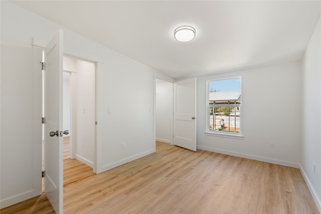 interior space with light wood-style flooring and baseboards