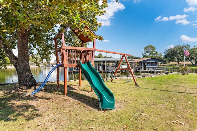 view of jungle gym with a water view and a yard