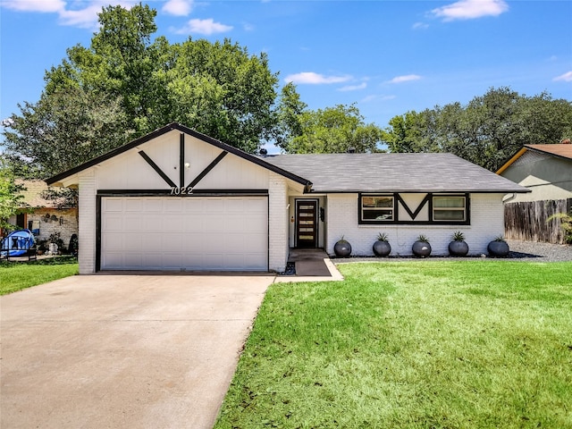 single story home featuring a garage and a front yard