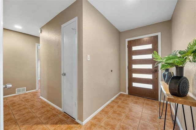 entrance foyer featuring light tile patterned floors