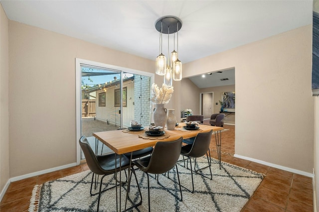 dining space featuring tile patterned floors