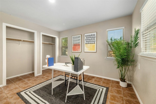 office area featuring a healthy amount of sunlight and tile patterned flooring