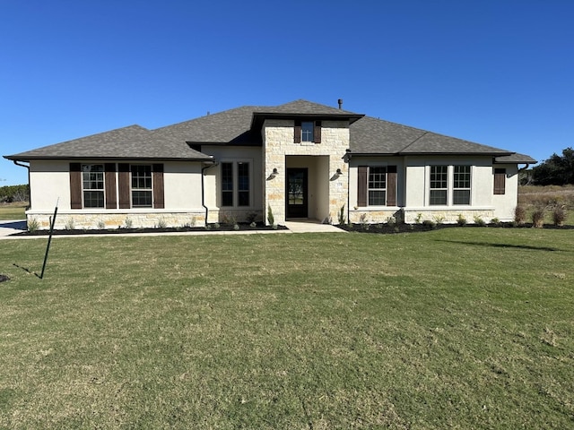 prairie-style home with a front lawn