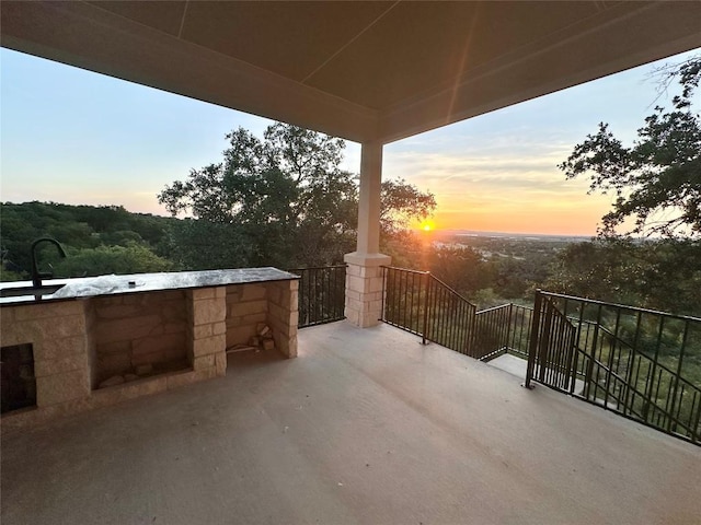 patio terrace at dusk featuring sink