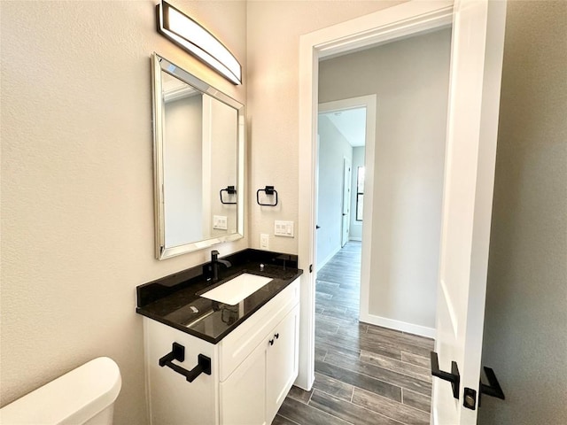 bathroom with vanity and toilet