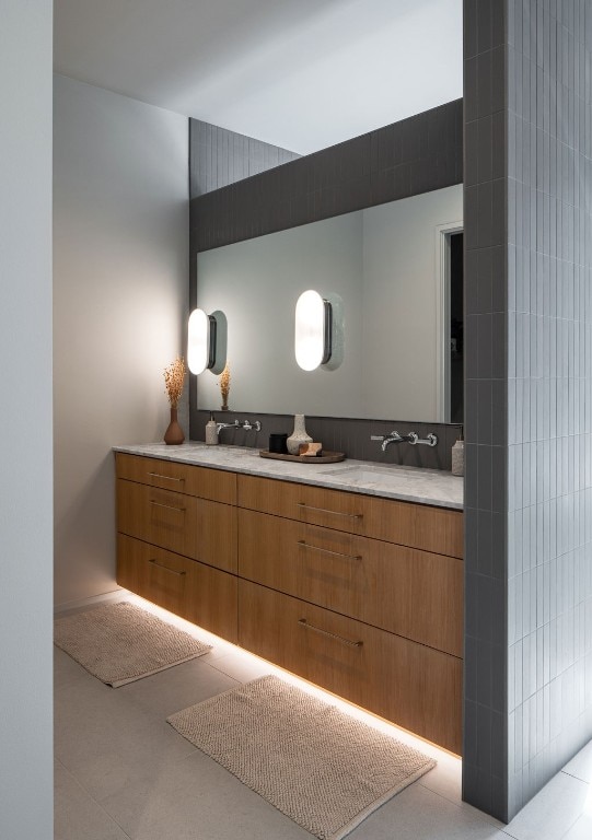 bathroom with tile patterned floors and vanity