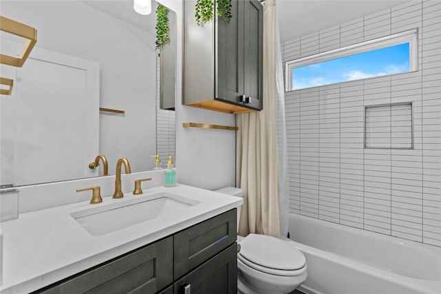 bathroom featuring shower / bath combo with shower curtain, toilet, and vanity