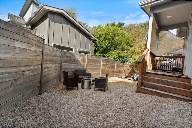 exterior space featuring a wooden deck and a fenced backyard