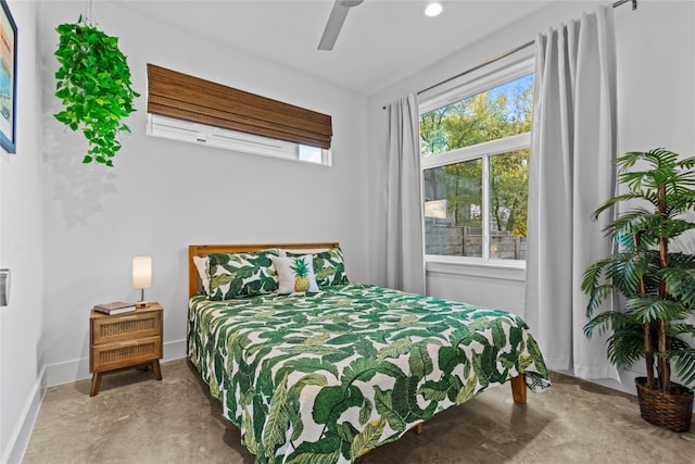 bedroom with concrete flooring and ceiling fan