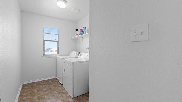 washroom with separate washer and dryer