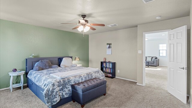 bedroom with ceiling fan and carpet flooring