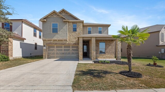 view of front of house featuring a front yard and a garage