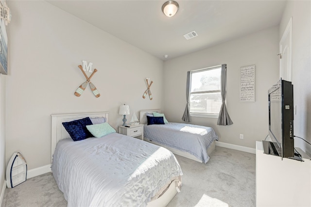 bedroom with light colored carpet