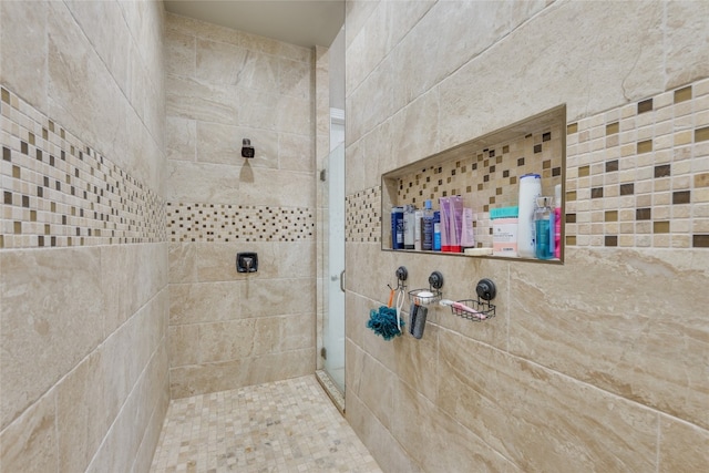 bathroom with a tile shower