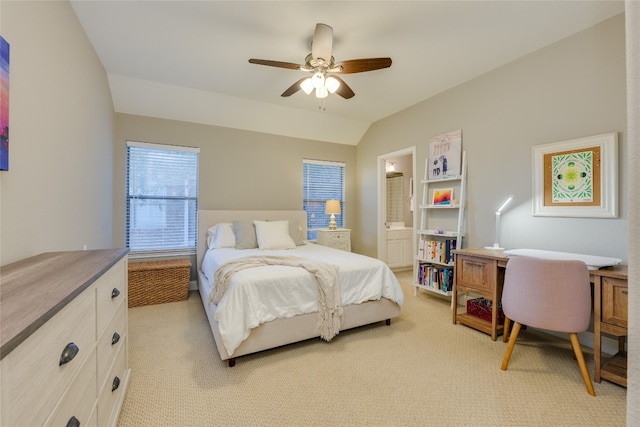 carpeted bedroom featuring connected bathroom, ceiling fan, and lofted ceiling