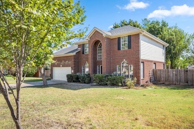 view of front facade with a front yard and a garage