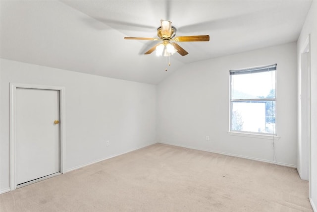 additional living space featuring light carpet, ceiling fan, and lofted ceiling