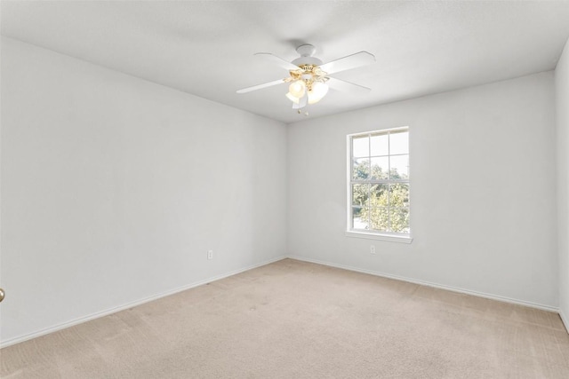 empty room with light carpet and ceiling fan