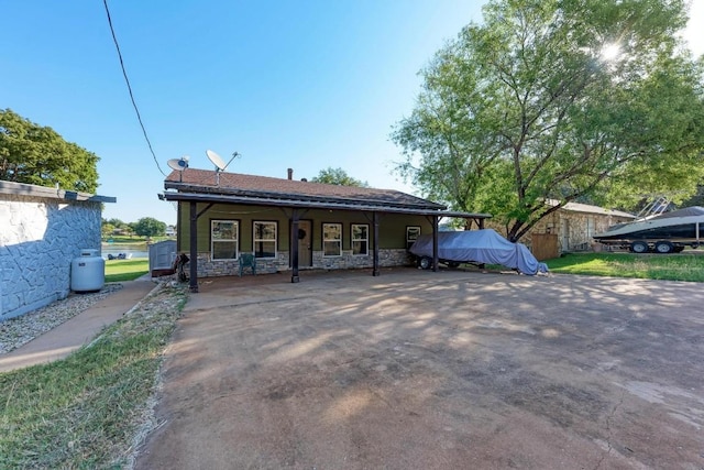 616 Sandy Harbor St, Horseshoe Bay, TX 78657 - rear view of house featuring stone siding and covered porch