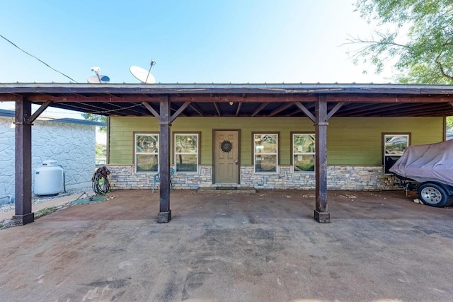 616 Sandy Harbor St, Horseshoe Bay, TX 78657 - view of front of home featuring stone siding and a carport