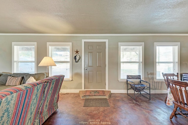 interior space featuring a healthy amount of sunlight, crown molding, and a textured ceiling