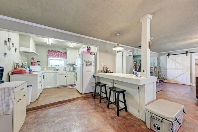 616 Sandy Harbor St, Horseshoe Bay, TX 78657 - kitchen featuring a barn door, white appliances, wall chimney exhaust hood, a textured ceiling, and finished concrete flooring