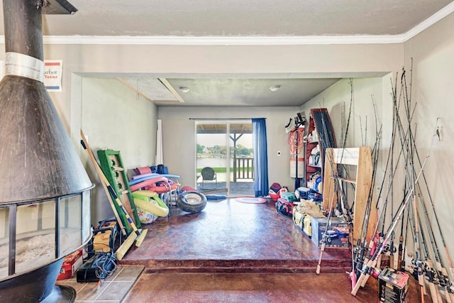 616 Sandy Harbor St, Horseshoe Bay, TX 78657 - recreation room featuring finished concrete flooring and ornamental molding