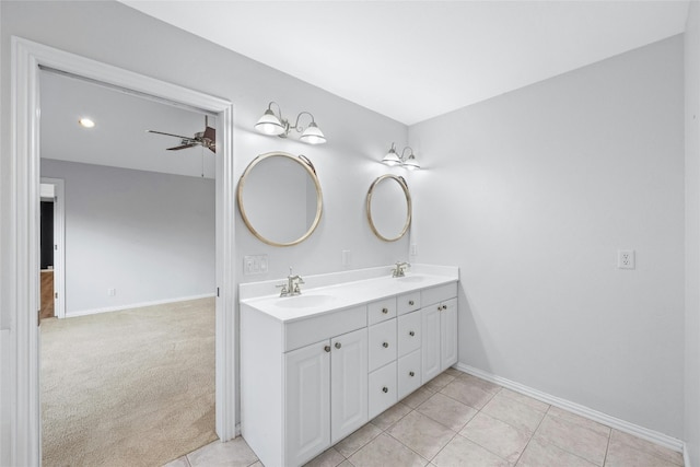 bathroom with ceiling fan, vanity, and tile patterned flooring