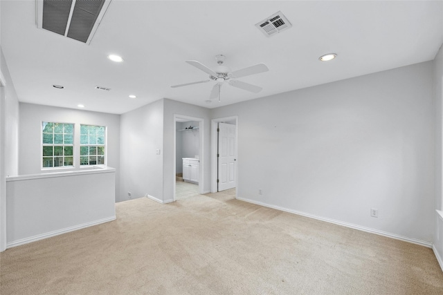 carpeted empty room featuring ceiling fan