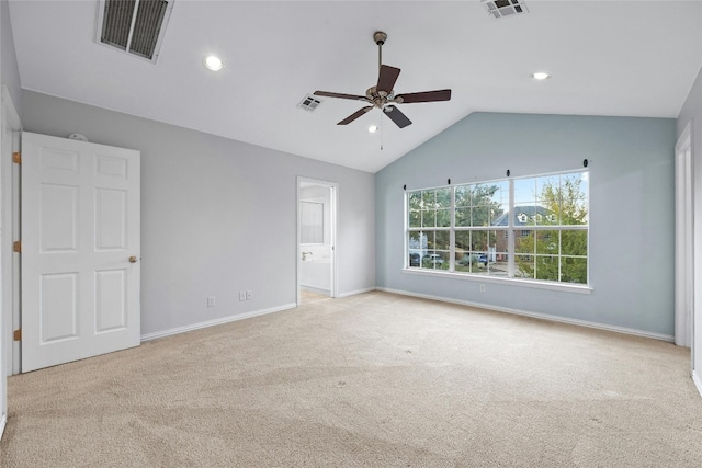 carpeted empty room featuring lofted ceiling and ceiling fan